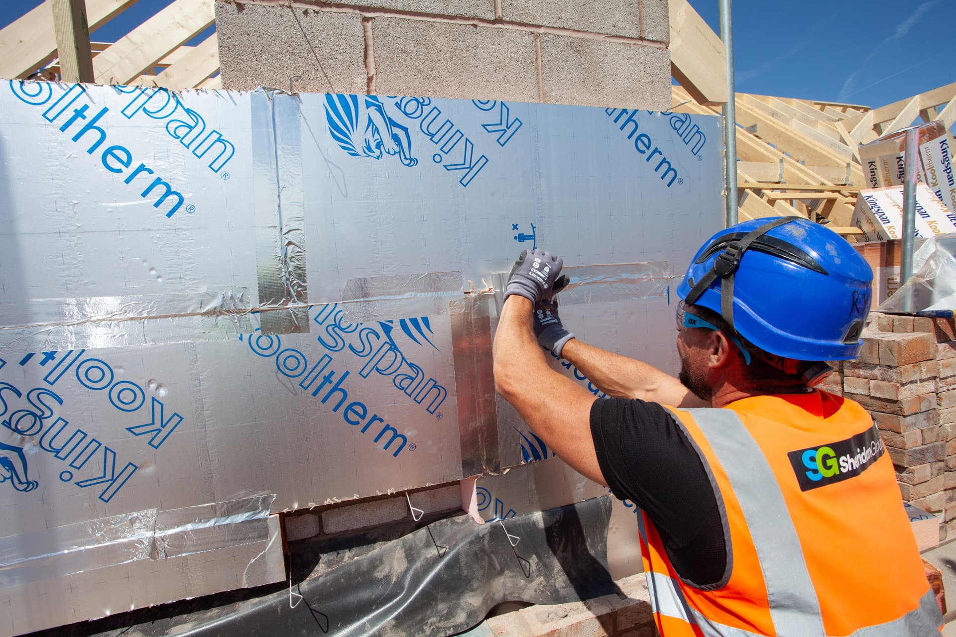 cavity wall insulation being installed by a builder
